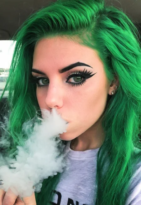 <lora:VapeXL-08:1.0> VapeXL, girl blowing smoke, green hair, eyeliner