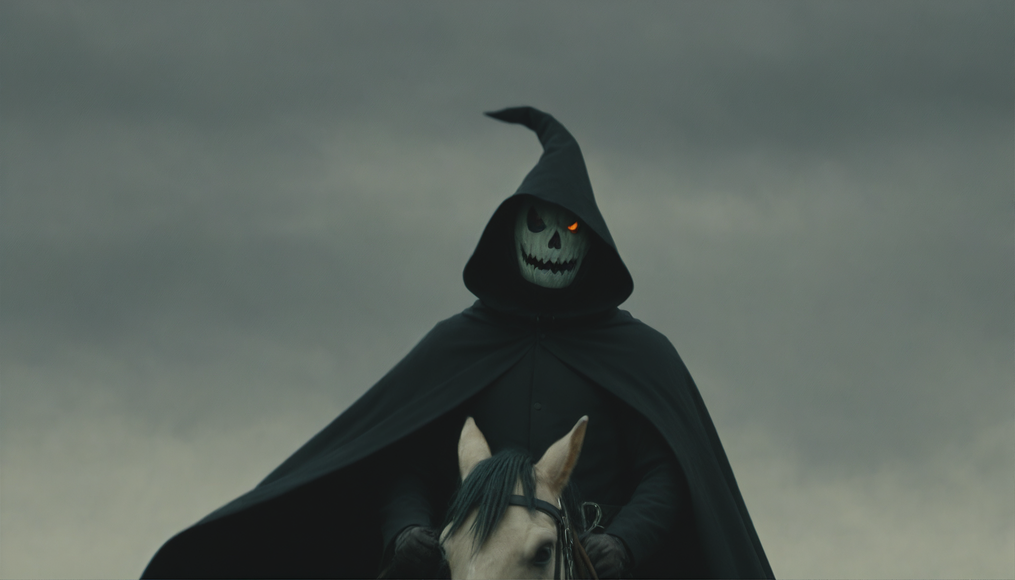 cinematic still of a man wearing a black cloak and a jack o lantern head, riding a dark horse