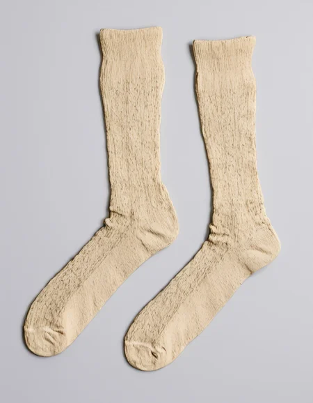 a vintage pair of socks, <lora:unworn_clothingno_peopleno_characters:1>,white background,