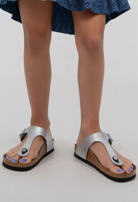 1girl, solo, dynamic_pose, simple_background, white_background, gizehonfeet, blue_toenail_polish, close-up, lower_body, footwear_focus, patterned, long_skirt