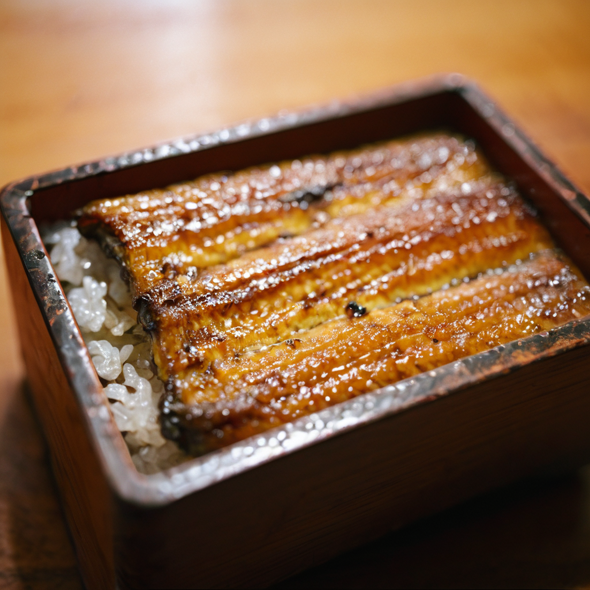 raw photography,film photography,film grain,close-up,unajyu on table,wood table,<lora:Unajyu:1>