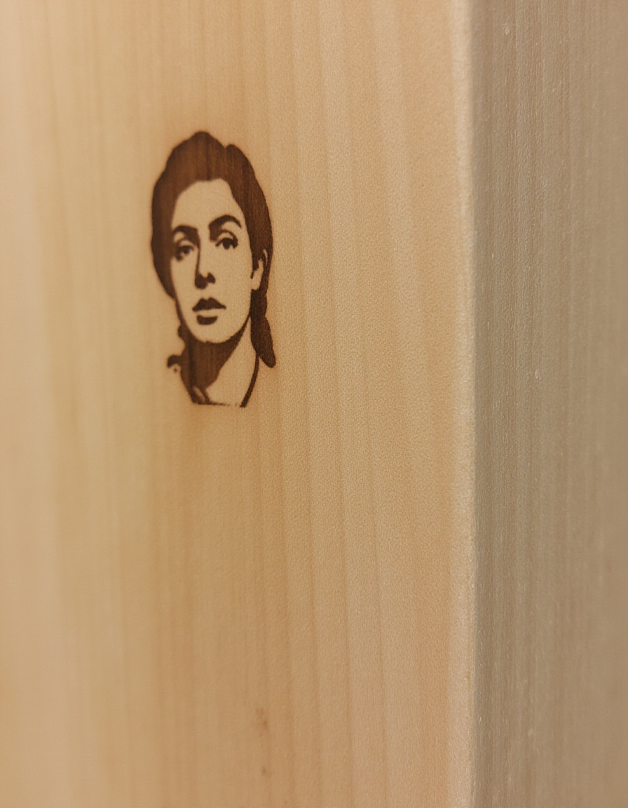 Close-up shot of a standard 2x4 wooden stud, with a few faint scratches etched into its surface. The wood grain is visible through the paint, giving it a slightly textured appearance. A face of a woman is engraved into the side of the 2x4., <lora:amateurphoto-v5-14-15-1-1:0.4> <lora:Another_Amateur_Lora:0.4> <lora:Phlux:0.4> <lora:UltraRealistic_Lora_Project:0.4>