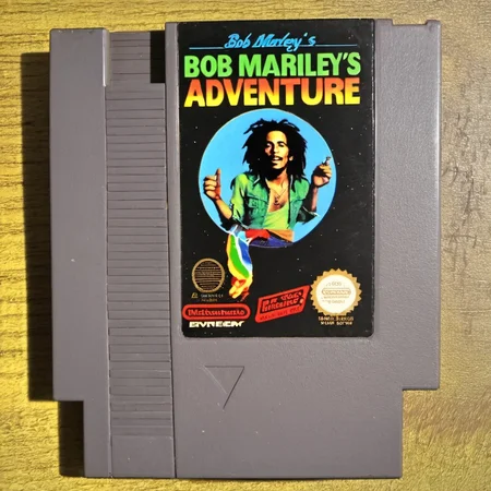 <lora:nes:1> nes video game cartridge, Bob Marley's Adventure, english text, no humans, solo, parody
