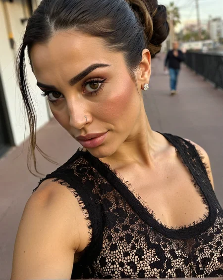 score_9, instagram photo, amateur, skin imperfections, skin pores, skin texture, photo of Sofia Morales, 30-year-old woman, from Mexico, olive skin, dark brown hair, high bun, diamond face-shape, detailed face, hazel almond eyes, detailed eyes, curled eyelashes, bold eyebrows, straight nose, full lips, detailed mouth, sharp cheekbones, angular jawline, 5"8 height, wearing a black lace crop top, close-up shot, low-angle, centered composition, urban background blurred, dramatic evening light, shallow depth of field.