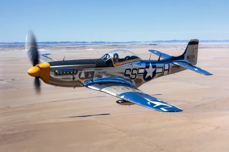 (masterpiece, best quality:1.2), ultra-detailed, flying through a blue sky P-51Mustang, (realistic:1.5), <lora:EdobP51Mustang_v1.0:0.8>