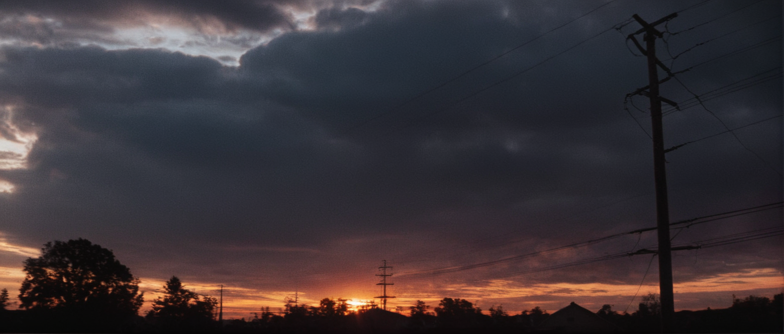 cinematic film still of  <lora:Fright Night 1985 style v2:1>
In the 1980's an epic sunset with a hdr view in the sky,outdoors,sky,cloud,no humans,cloudy sky,scenery,sunset,sun,power lines,utility pole , horror themed, dark themed, low key light, dramatic light, dramatic shadow light, contrast, cinematic color, cinematic look, filmic, realistic, realism, perfection, perfect, Kodak, Kodak film, movie still, Fright Night 1985 style, Fright Night Film style, shallow depth of field, vignette, highly detailed, high budget, bokeh, cinemascope, moody, epic, gorgeous, film grain, grainy