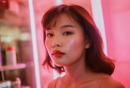 (80sPortrait), indoors, beautiful young Asian woman, glossy lipstick, closeup, shop, neon lights