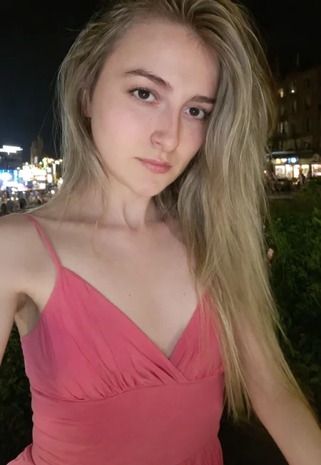 Masterpiece, detailed, realistic, photorealistic, negativeXL_D, sdxl_cyberrealistic_simpleneg, 1girl, detailed face, cute, city background, mid twenties, small breasts,  pink flowing dress, long hair, blonde highlights, Chiaroscuro Lighting Style