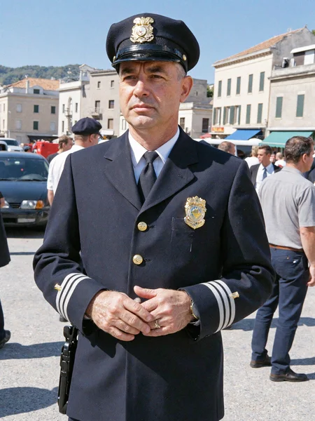 louis de funes, le gendarme de saint-tropez, 1964, black and yellow photo, realistic, intricate details, hyper-detailed, kodak 30mm lens, professional photoshoot, full-hight scene view