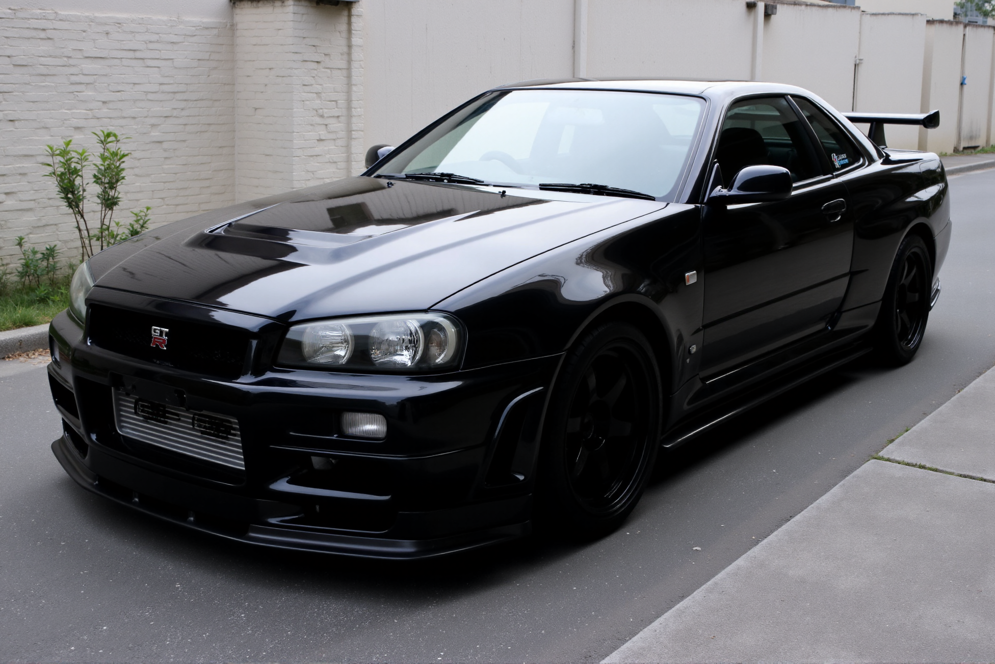 <lora:Nissan_Skyline_GT-R_R34:0.85> A black Nissan Skyline GT-R R34 from '90.
 (Extremely shiny and reflective high gloss finish with bright glints:1.2).