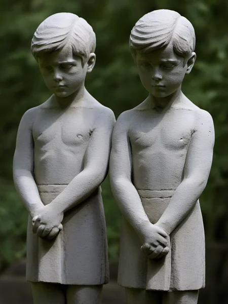 two boys stone statures waiting in a pose <lora:talesofthegraveyard:1>