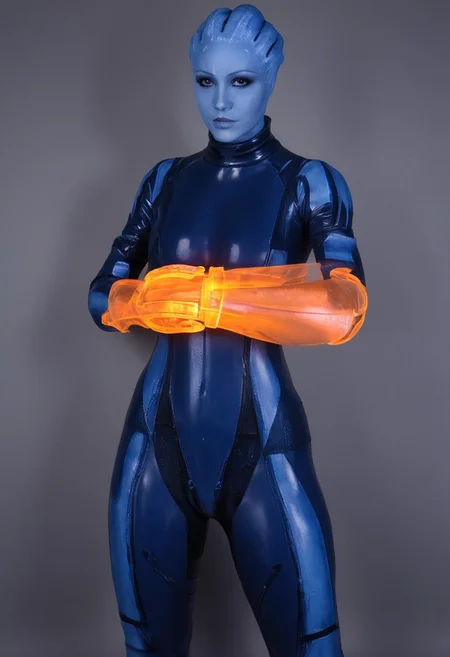 zavy-asari, alopecia, blue skin, Asari, orange omnitool on arm, glowing omnitool, latex bodysuit, looking at omnitool, latex zero suit, score_9, score_8_up, score_7_up, score_6_up, masterpiece, omnitool left arm, one arm omnitool