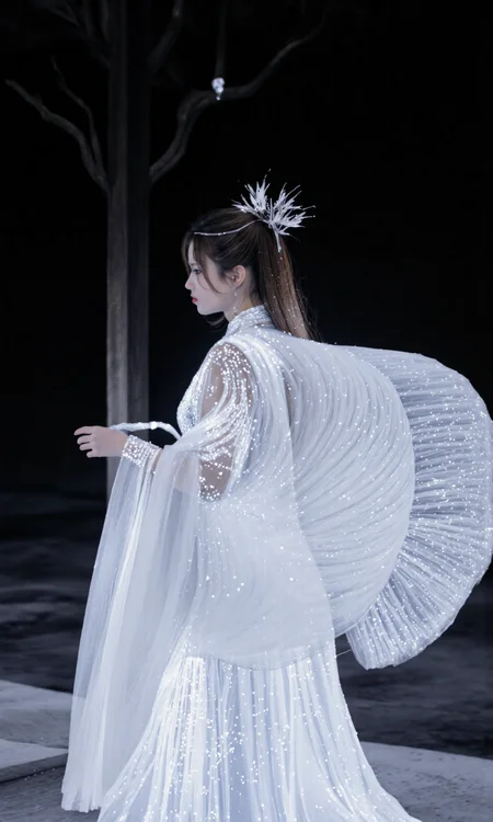 Top Atmosphere Photography Works, extremely realistic, Art by Zhang Jing.
a fairy wearing (a white Hanfu/made of glowing fiber optic circuits, luminescent fiber-optic electrical circuits), a pair of folded white glowing giant feather wings, the surrounding is a dark, empty void. the image is high quality and vivid with tech aesthetics.
(photorealistic:1.2), (Extremely realistic, masterpiece, top quality, official art, best quality, beautiful and aesthetic:1.2), 4k, 8k, very rich details, 24bit colors, vivid colors, cinematic color grading,