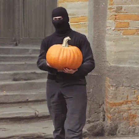 balaclava, , guerilla, plain wall background, uniform, holding a pumpkin, lacing <lora:lowfi-step00015000:1> the ira kidnapping a pumpkin