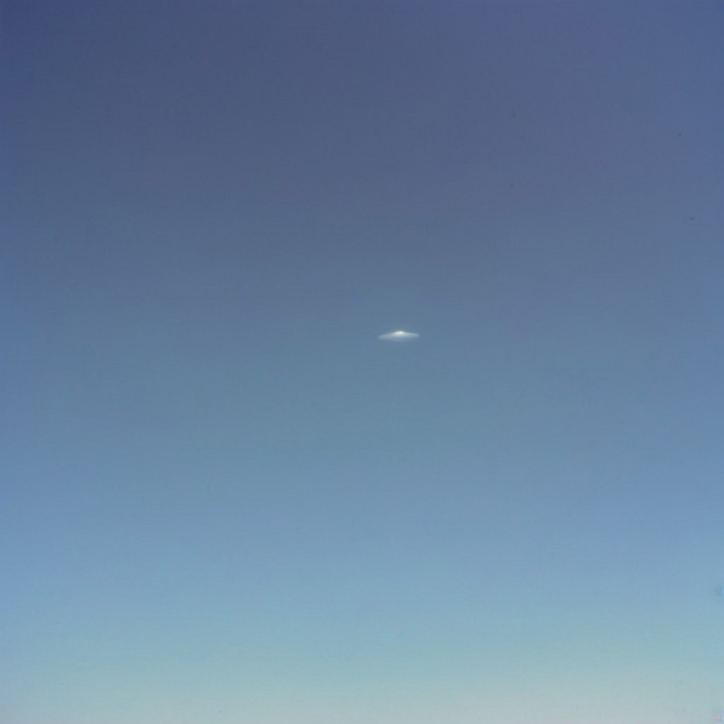 (olddigitalcamera, raw, light leak, film grain, jpeg artifacts, low res, low quality):2, distant UFO, flying saucer, hovering in the sky, far away
