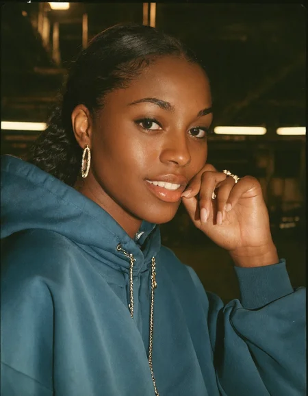 analog film photo. hip-hop theme, urban, close-up shot, dynamic portrait of a breathtaking Basotho model with a small smile wearing an oversized baggy and loose tracksuit in a cluttered warehouse, (puffy eyes:1.2), detailed face, stunning beauty, detailed skin, skin texture, skin pores, (freckles:0.9), bling bling, drip drip. Hard light, hard shadows, faded film, desaturated, 35mm photo, grainy, vignette, vintage, Kodachrome, Lomography, stained, highly detailed, found footage