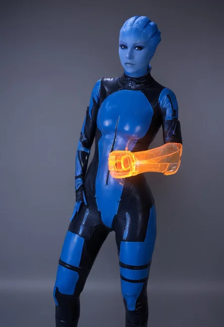 zavy-asari, alopecia, blue skin, Asari, orange omnitool on arm, glowing omnitool, latex bodysuit, looking at omnitool, latex zero suit, score_9, score_8_up, score_7_up, score_6_up, masterpiece, omnitool left arm, one arm omnitool