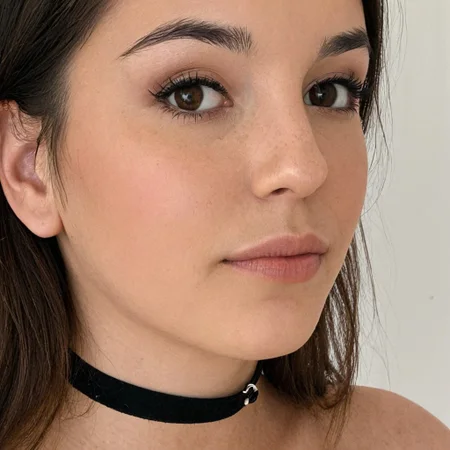 Close portrait of young brunette, choker