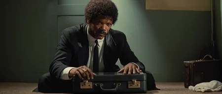 cinematic film still of  <lora:Pulp Fiction style:1>
Jules Winnfield a man is holding an open suitcase,black hair,1boy,holding,sitting,weapon,male focus,gun,facial hair,handgun,realistic,revolver , 1990's, 90's, film, cinematic, crime and violence, classic, graphic violence, Kodak film, motion picture image,Pulp Fiction style, Pulp Fiction Film style, shallow depth of field, vignette, highly detailed, high budget, bokeh, cinemascope, moody, epic, gorgeous, film grain, grainy