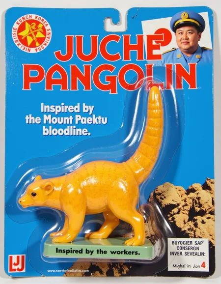 North Korean Juche Socialist propaganda, a big rubber figurine of a pangolin named Juche Pangolin, on a blue LJN card., inspired by the workers, conceived by the Mount Paektu bloodline