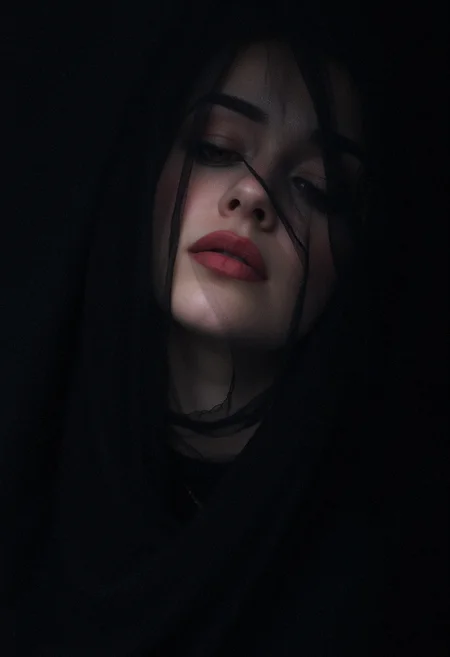 A mysterious woman with her face partially obscured by a black veil. Only her lips are visible, forming a enigmatic smile. The rest of the image is blurred, focusing solely on her lips. The lighting is soft, casting a faint shadow over her face, adding to the intrigue. The scene feels intimate and secretive. <lora:FluxDFaeTasticDetails:0.8> <lora:aidmaHyperrealism-FLUX-V0.1:0.45> aidmaHyperrealism,