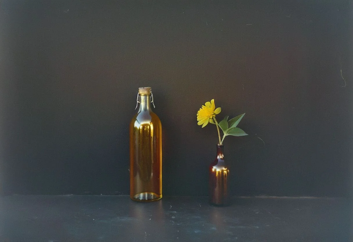 zenit_kodak_gold, instagram photo,a bottle with a flower, hard shadows, film grain