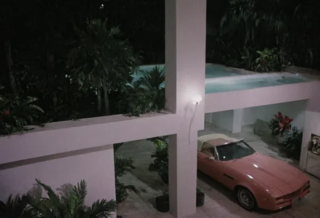 analog film photo MiamiVice, indoors . faded film, desaturated, 35mm photo, grainy, vignette, vintage, Kodachrome, Lomography, stained, highly detailed, found footage