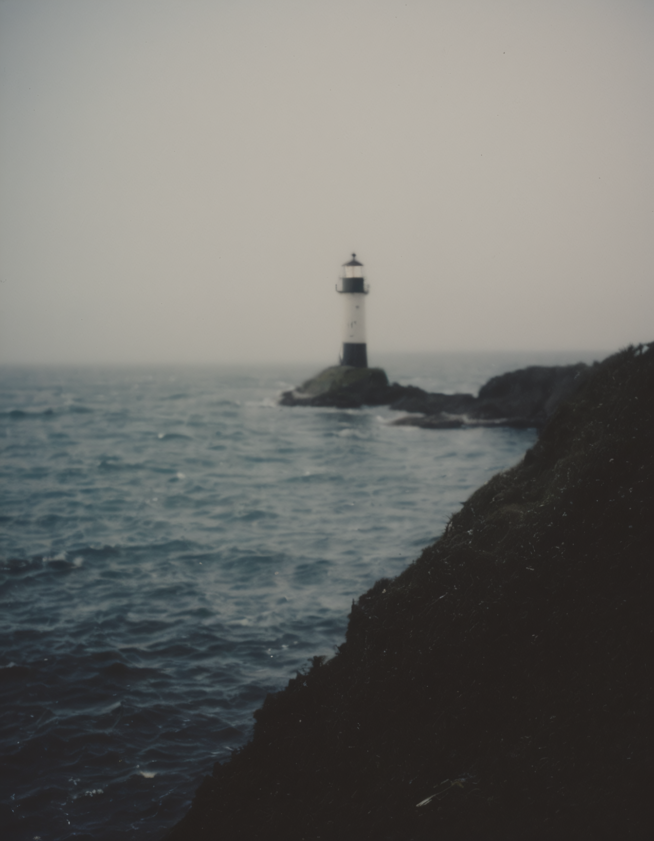 polaroid film photography, faded film, soft focus, film grain, a lighthouse in heavy sea on a shore, 4k, uhd, masterpiece