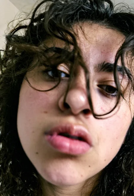 ((heavy digital grain)), ((lo-fi photo)), 2017 mobile phone quality, close-up portrait of female lips, messy hair falling across face, slightly blurry, noisy image, authentic bedroom setting background (out of focus)