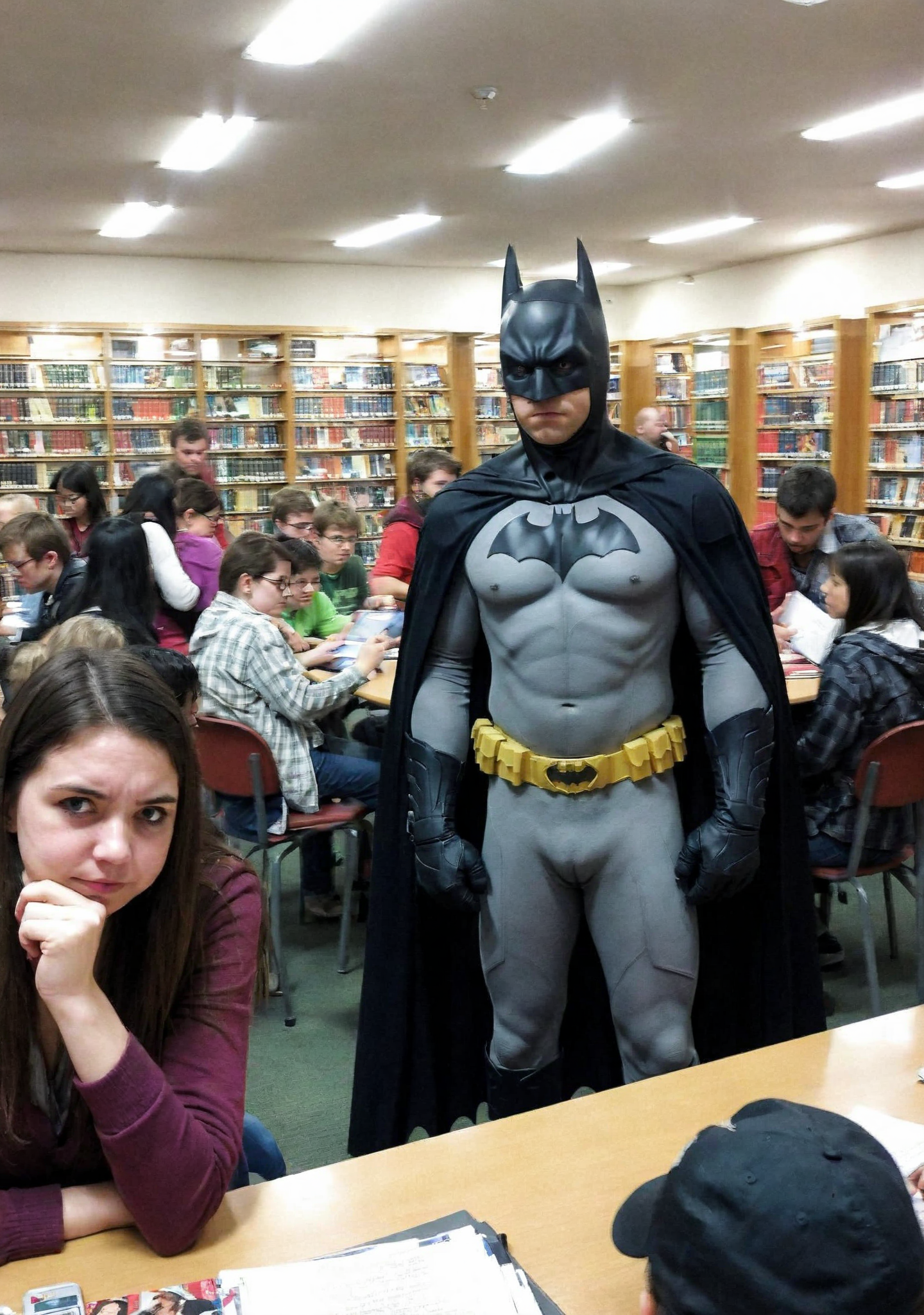 amateur photography,
<lora:badquality_v02:1.2>, low quality, bad quality, 
embarrassed batman  in busy crowded library
surrounded by people, men and women