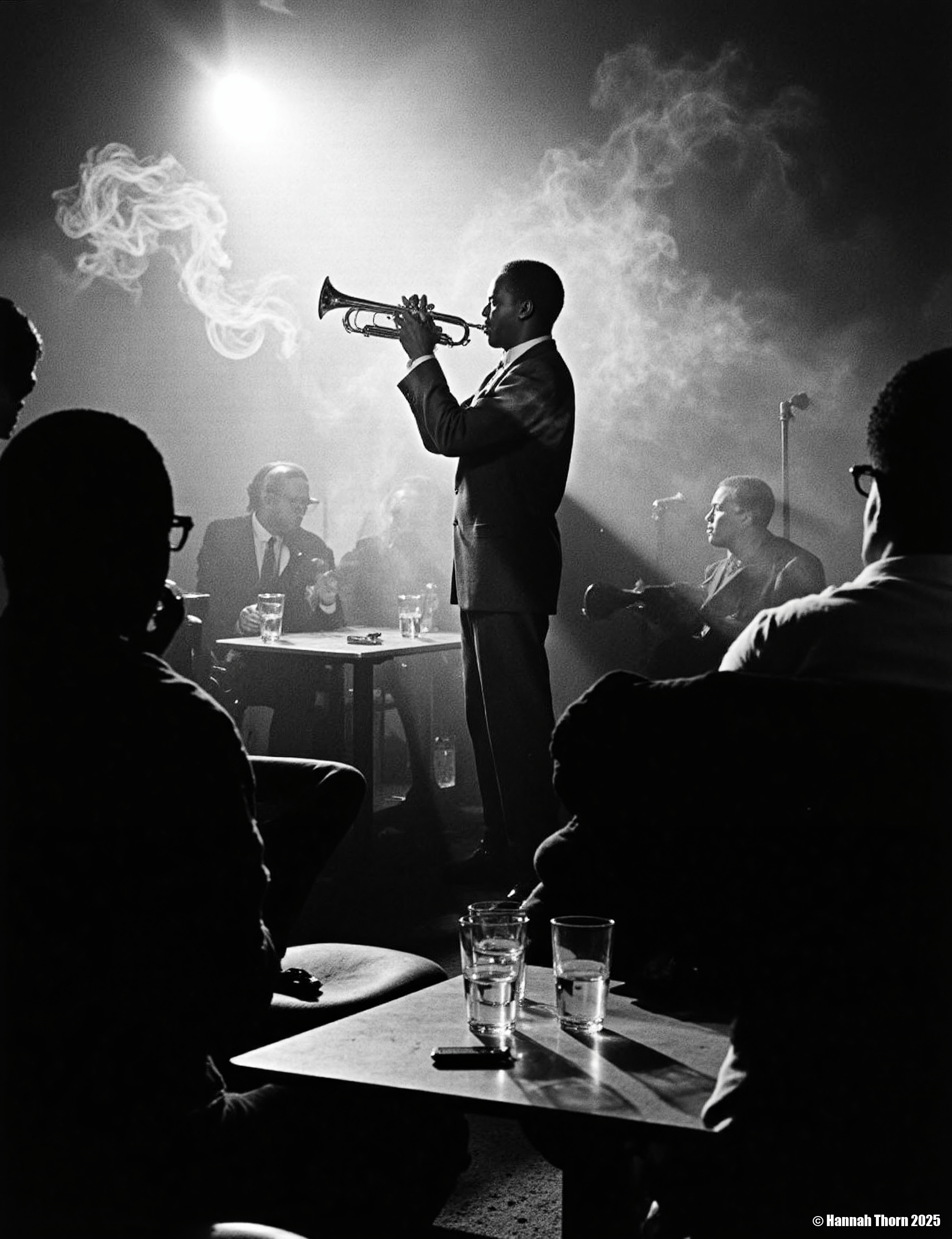 The image is a black and white photograph of Miles Davis playing his trumpet.    **Description:**  The photo is taken in a dimly lit, smoky environment, possibly a jazz club. Davis is centrally positioned, but slightly off-center, his body angled towards the trumpet. He's captured mid-performance, his face partially obscured by shadows and the smoke, creating a dramatic and mysterious atmosphere.  He's wearing a dark suit. His focus is entirely on his instrument.  In the foreground, the backs of other patrons are visible, partially silhouetted, seated at a table with glasses, suggesting the scene is from a live performance.  The smoke adds depth and texture to the photo, and the lighting creates strong contrast, with bright spots highlighting Davis and his trumpet, and leaving the rest in shadows.  The overall feeling is intimate and moody.  **Style:**  The photograph's style is strongly reminiscent of classic jazz photography. It uses elements of:  * **Chiaroscuro:** The dramatic use of light and shadow to create strong contrasts and a sense of depth. * **High Contrast:** The deep blacks and bright whites add to the intensity and emotion of the scene. * **Documentary style:** It seemingly captures a candid moment from a real-life event, without significant staging.  While composed, the image feels unplanned, spontaneous, and captures the essence of the moment. * **Grainy texture:** The texture of the photo suggests a potential film grain, further adding to its vintage aesthetic and enhancing the atmosphere. * **Silhouettes:** The use of silhouettes for the audience members in the foreground adds to the intimacy and focuses attention on Davis.  The overall aesthetic is evocative and atmospheric, capturing the mood and ambiance of a jazz club during a performance.  The style is both artistic and journalistic, conveying both the emotional energy of the performance and a sense of reality. <lora:_Flux\Vintage_Jazz-Club.safetensors:1.0:1.0>