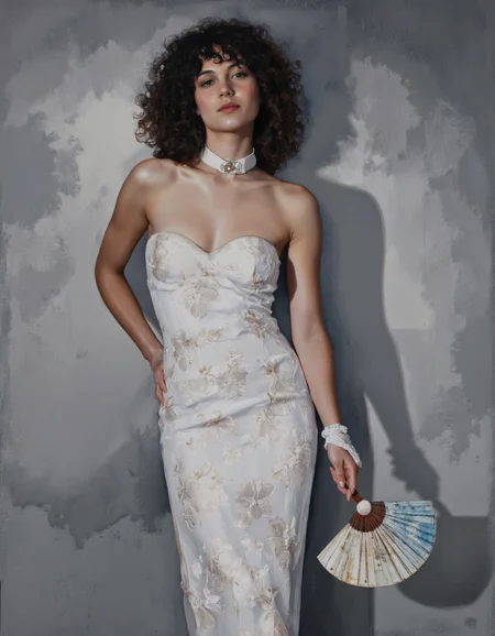 Art by Linda Delahaye.
A photo-realistic portrait of a woman with curly black hair, painted in a realistic style with a soft, muted color palette. the woman, who appears to be in her late 20s, is standing in the middle of the image, wearing a strapless white dress with a floral pattern and a white collar, holding a hand fan in her right hand. her hair is styled in long, curly locks, and she has a neutral expression on her face. the background is a simple, textured gray wall with a subtle shadow cast on it, creating a sense of depth and dimension. the lighting is soft and diffused, casting gentle shadows that accentuate her figure. the overall mood is elegant and sophisticated, with a focus on the woman's beauty and the intricate details of the hand fan.