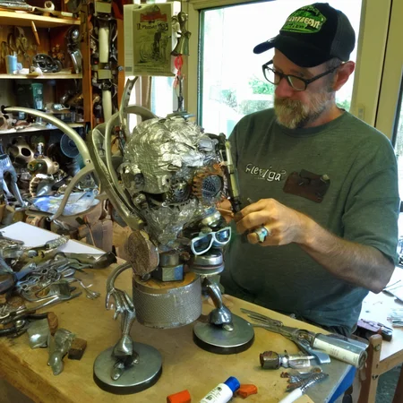 recyclforge sculptor artist at work on works<lora:recyclforge:0.6>