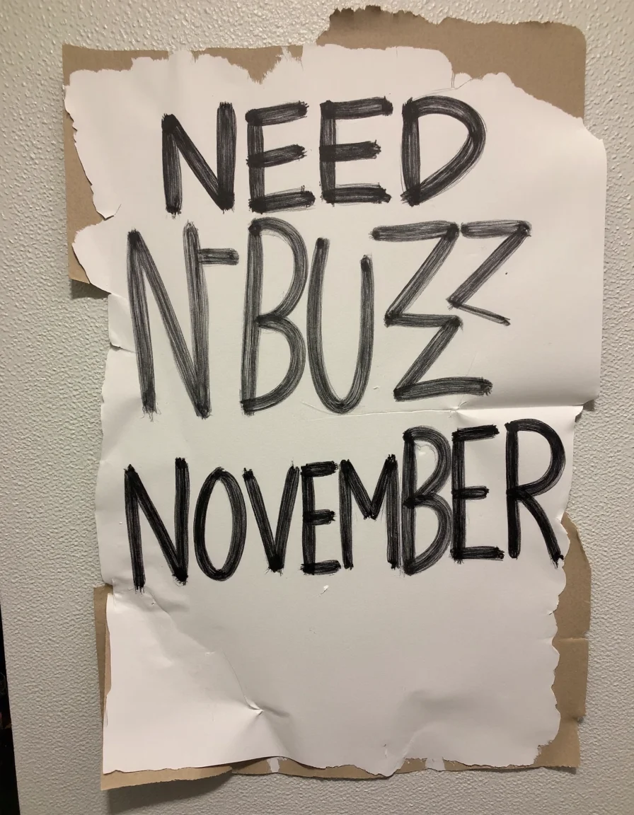 decayart, sign written "Need N-BUZZ NOVEMBER"