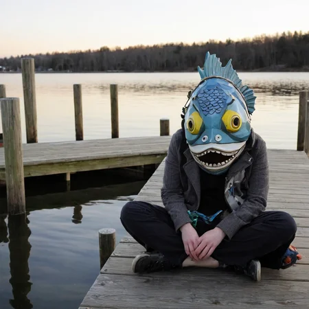 <lora:SDXL_Mask_Sa_May:1> mask, a person sitting on a dock with a fish mask on