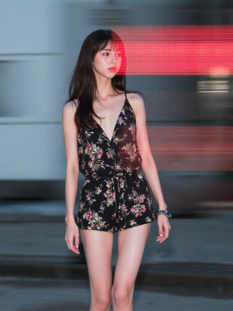 There are wonderful studio lights and various reflections,
18yo beautiful cute girl with blushing and female orgasm.skin naturally showing the texture of blood vessels and detailed pale skin,
--,
<lora:Nakajo_Ayami_f1:1>,she is Nakajo Ayami,
(Floral_printed_romper:1.5),(Wedge_sandals:1.4),(Stacked_bangles:1.3), Lines of Movement, HAS12345.3FR, A young woman dominates the frame, partially obscured by streaks of fast-moving digital text in red and black. Her expression is calm and composed, her dark eyes focused ahead with a quiet intensity. The lighting is soft and cool, highlighting the smooth texture of her skin and her hair, which blends with the shadows of her. The woman stands in an urban setting, but the background is blurred with motion, fading into soft grays and blues, indicating the city but leaving it abstract.The red streaks of digital text, sharp and bright, cut across the scene horizontally, giving the image a futuristic, cyberpunk feel. The contrast between the womanâs soft, natural features and the harsh, glowing text creates tension, as though she exists between two worldsâone of calmness and one of fast-paced digital information. The composition draws the viewerâs eye to the womanâs face while also directing attention to the moving text that surrounds her. The interplay of light and shadow is subtle, allowing the glowing text and the woman's focused gaze to take precedence.The overall atmosphere is mysterious and slightly futuristic, evoking themes of technology, modern life, and isolation in a digital world. The image suggests a person in tune with both the physical and digital environments, navigating between them with ease.,#æ°å­åçº¿èå