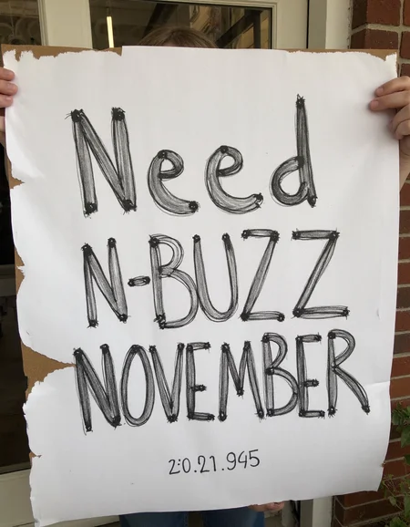 decayart, sign written "Need N-BUZZ NOVEMBER"