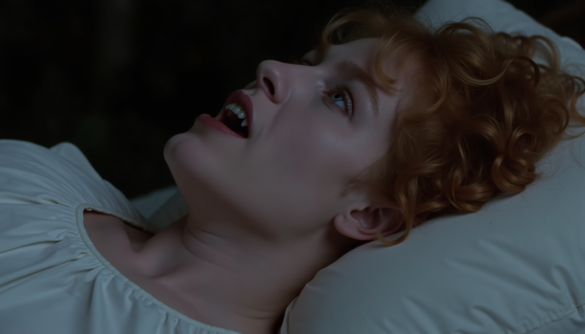 cinematic close-up shot of 20 y.o. vampire woman lying on a bed, gasping showing fangs, pale skin, curly red hair spread over pillow, wide open blue eyes staring up, wearing a white night gown, taken from the side, at night in soft light, photorealistic <lora:iwtv_flux_1_0:1>