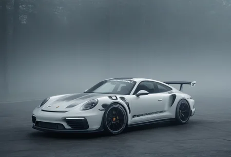 Techwear fashion porsche rsr,<lora:CHV-Zoom:1>,Cornelisz Hendriksz Vroom vehicle,car,foggy [1],glossy white [2], . Futuristic, cyberpunk, urban, tactical, sleek, dark, highly detailed