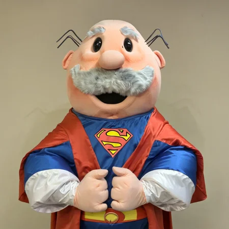 bust shot photo of drsimi mascot as superman <lora:drsimi-000004:1>