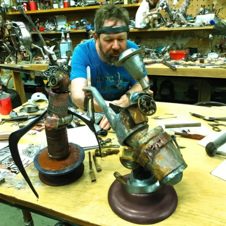 recyclforge sculptor artist at work on works<lora:recyclforge:0.6>