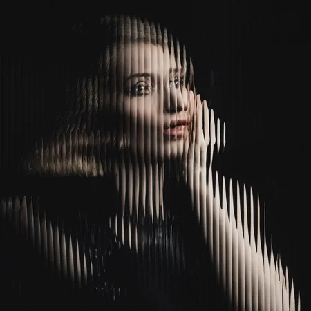 a woman going, black background, curved glass, textured glass, fluted glass <lora:SDXL_Textured_glass_Test_Sa_May:1>
