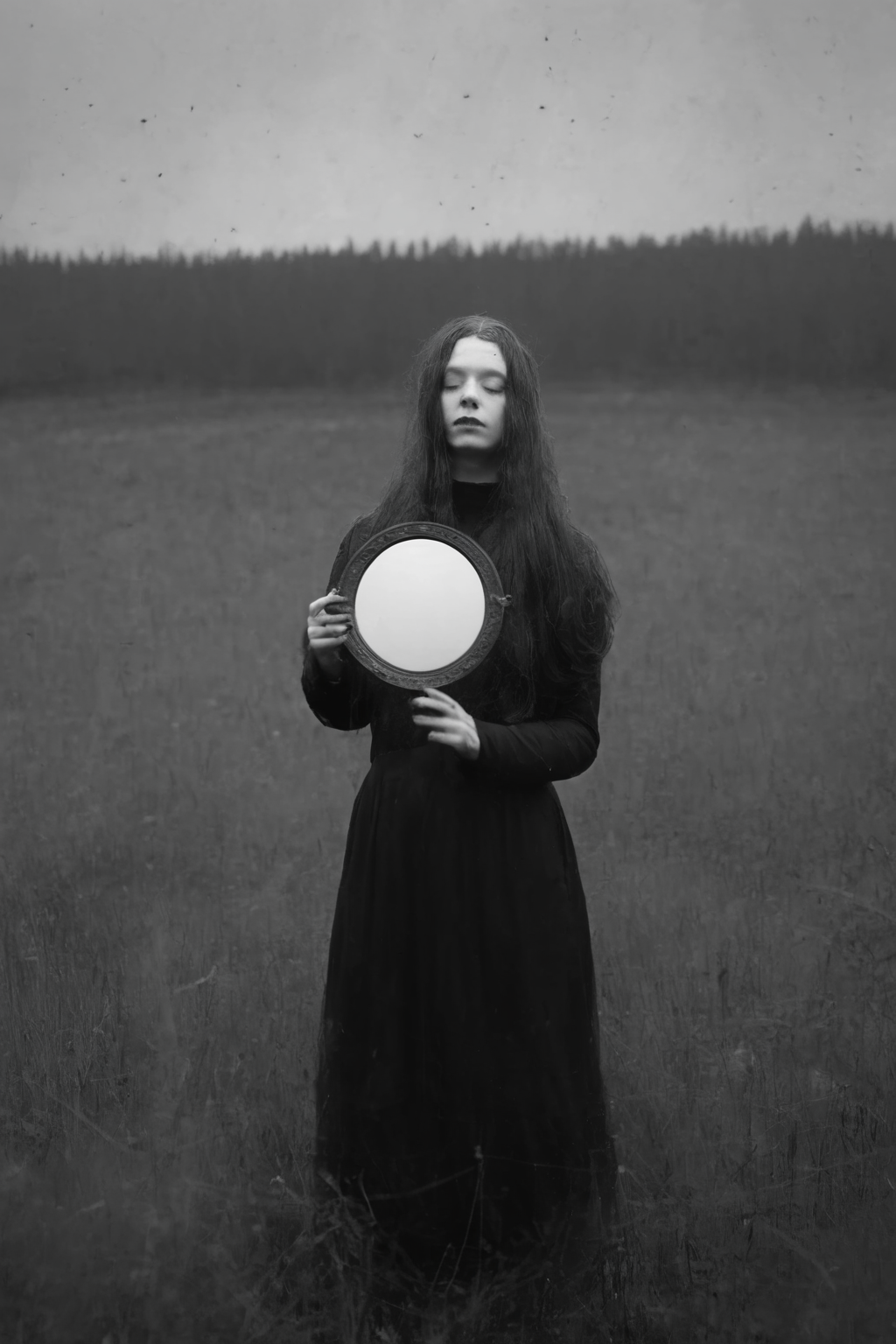 <lora:Photographer Maren Klemp Style:1>Photographer Maren Klemp Style - a black and white photo of a person holding a mirror in a field