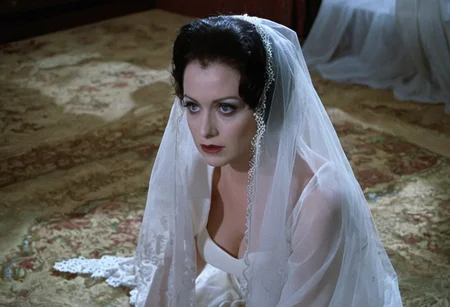 cinematic frame (close-up face:1.2) of a bride kneeling, face focus, from above, white lace veil, blue eyes, blank facial expression, detailed skin, photorealistic, soft light, creepy atmosphere, style of gothic horror films <lora:h4mm3r:0.8>
