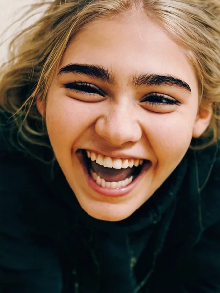 Cinematic fashion photograph Rebekka_Larsson_P_MXAI_SDXL close up shot, laughing expression Rebekka_Larsson_P_MXAI_SDXL