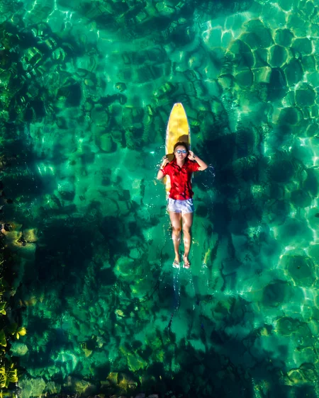 vertical perspective aerial photography, sunlight_shadow, clear_waters, looking_up, lying_down, <lora:sky:0.8>