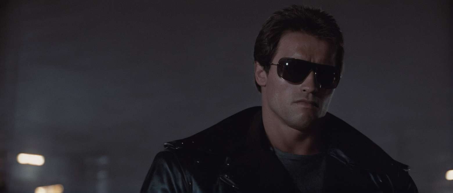 cinematic film still of  <lora:Terminator style:0.8>
In the 1980's Terminator a man in a leather jacket and sunglasses,solo,shirt,black hair,1boy,jacket,upper body,male focus,open jacket,black jacket,facial hair,sunglasses,realistic,leather,leather jacket , horror themed, dark themed, low key light, dramatic light, dramatic shadow light, contrast, cinematic color, cinematic look, filmic, realistic, realism, perfection, perfect, Kodak, Kodak film, movie still, Terminator style, The Terminator 1984 Film style, shallow depth of field, vignette, highly detailed, high budget, bokeh, cinemascope, moody, epic, gorgeous, film grain, grainy