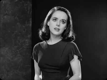A Black and White Movie Still, A woman wearing a black dress, black hair, dark background