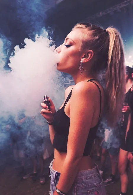 <lora:VapeXL-08:1.0> VapeXL, girl blowing smoke, rave