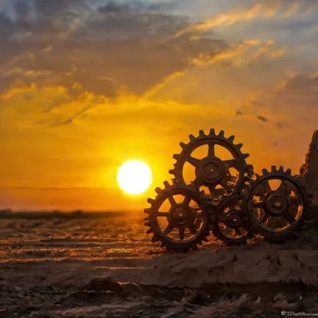 F-B-C, foreground: small gears, background: sunset,sun rays, effect: sun as gear between gears